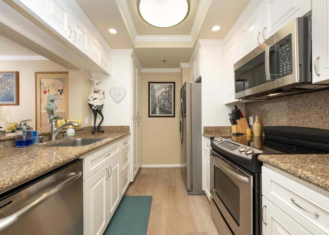 Renovated kitchen with white cabinetry