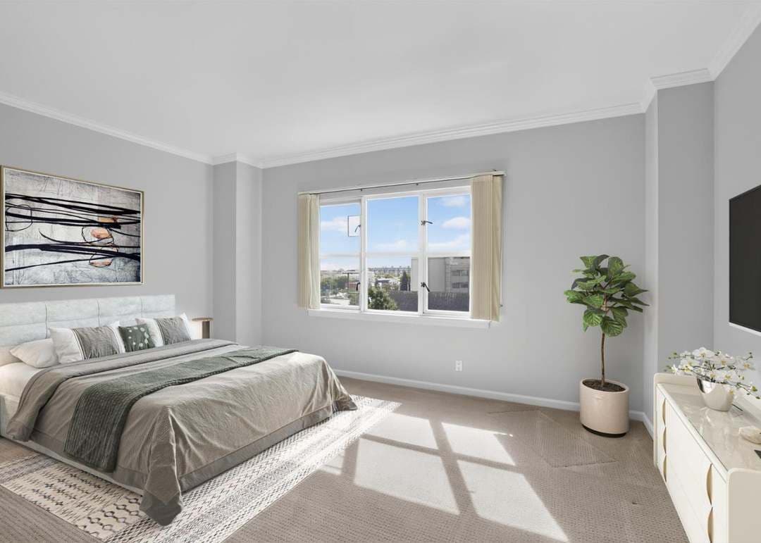 Bedroom with natural light and king bed