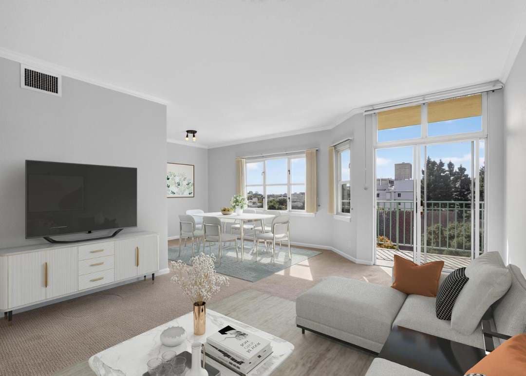 Spacious living room with large windows and tastefully decorated