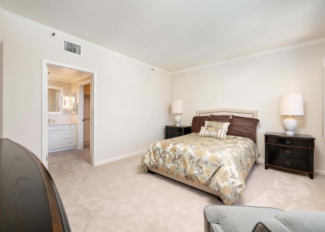 Spacious bedroom with queen bed and night stand